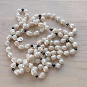 Long River pearls white with silver balls. 54 inches total length. Unique